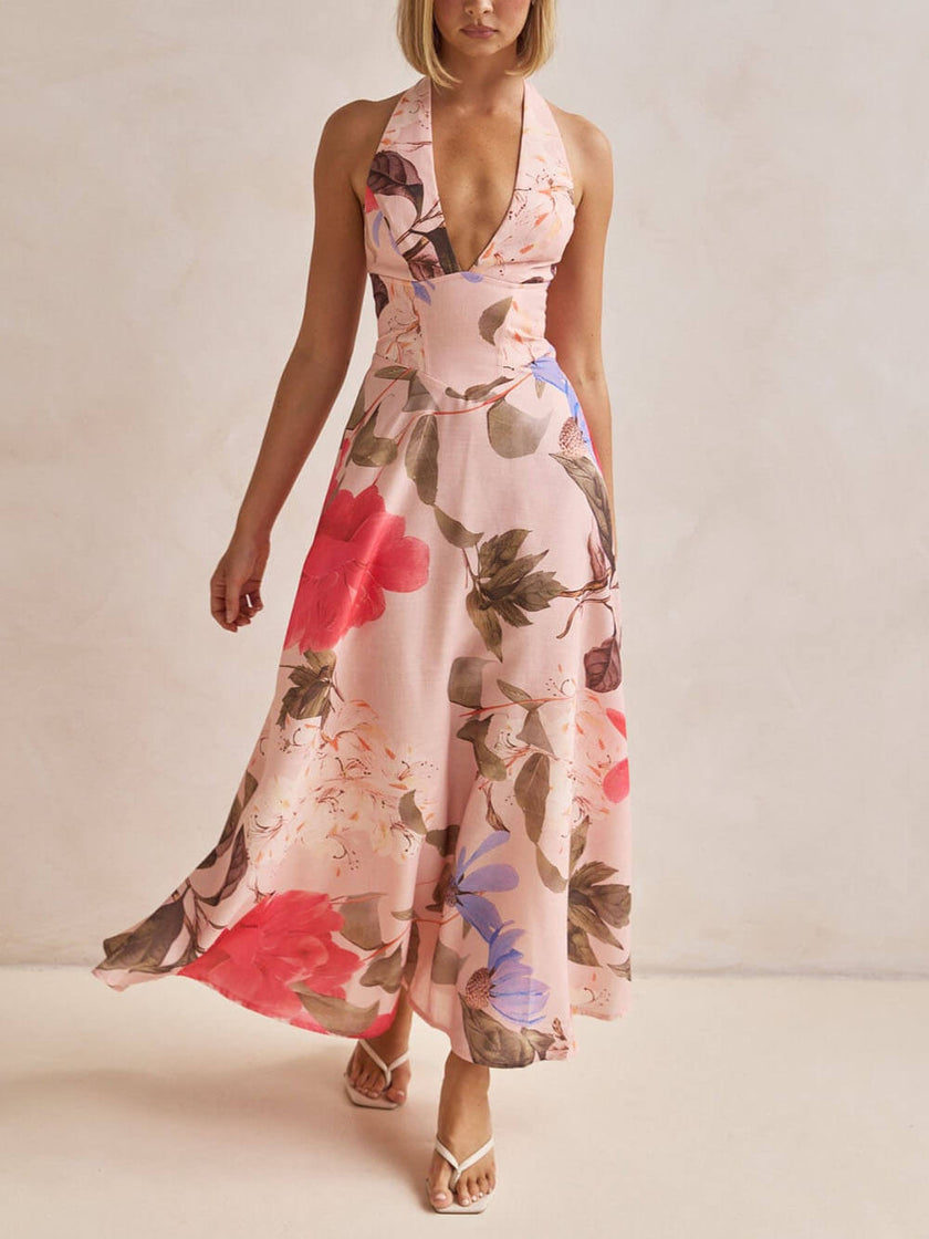 FJØRNA floral print halter backless tie-up women's maxi dress with flowing fabric and vibrant floral design.