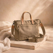 Large FJØRNA canvas messenger bag for women with adjustable strap and front pocket, stylish and functional accessory.
