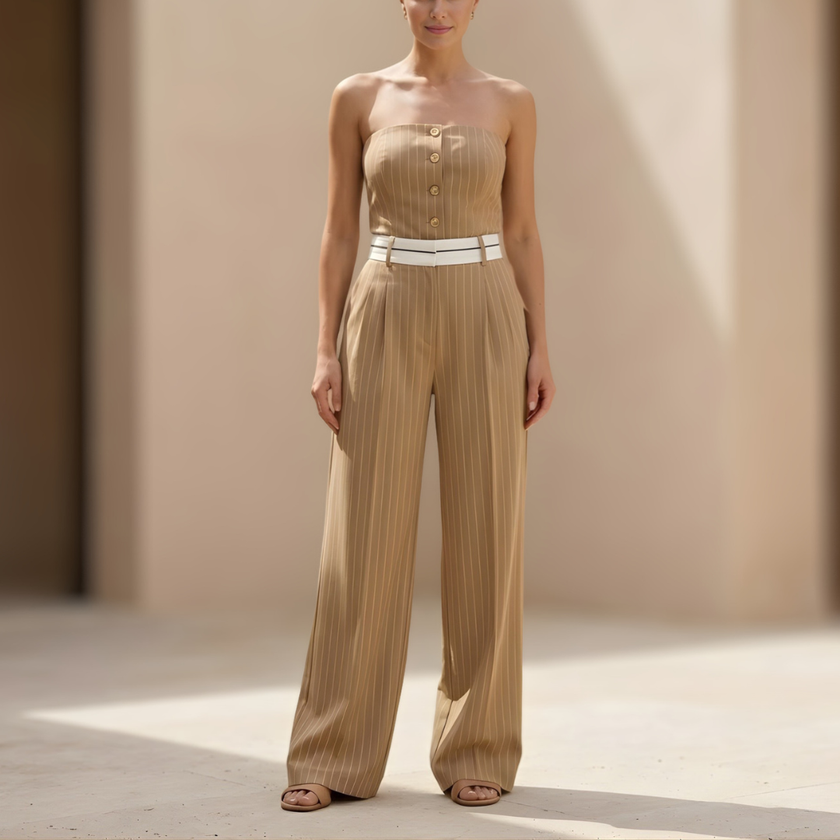 Women’s pinstripe strapless wide-leg jumpsuit by FJØRNA, featuring a fitted bodice and flowing wide-leg pants, perfect for stylish occasions.
