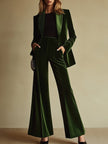 Emerald green velvet two-piece suit set by FJØRNA, featuring a loose fit with tailored blazer and matching wide-leg pants.