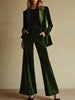 Emerald green velvet two-piece suit set by FJØRNA, featuring a loose fit with tailored blazer and matching wide-leg pants.