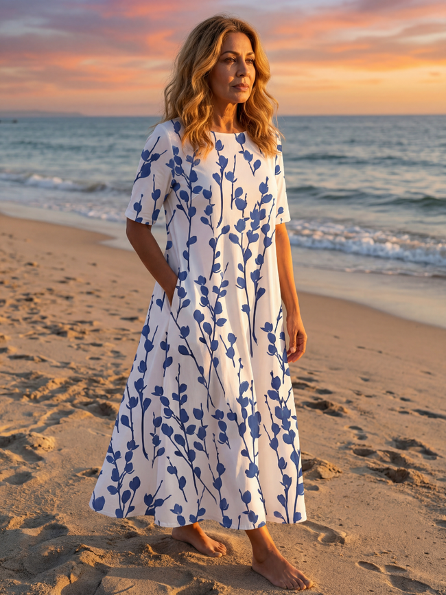 FJØRNA women's floral summer midi dress with short sleeves and wrap design, casual and stylish for warm weather.