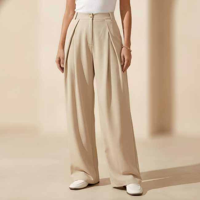 Women’s high waisted wide leg tailored trousers by FJØRNA, featuring a sleek fit and classic design, displayed on a white background.