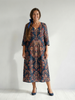FJØRNA women's summer midi dress with long sleeves, wrap style, flowy design, and premium fabric, perfect for warm weather.