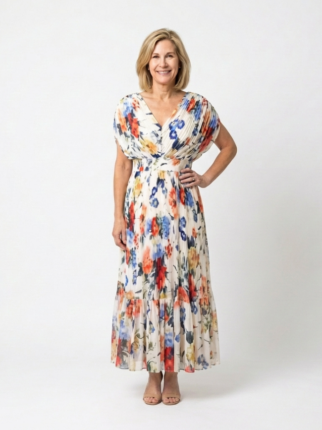 FJØRNA women's floral pleated summer midi dress with lightweight fabric and feminine design, ideal for warm-weather occasions.