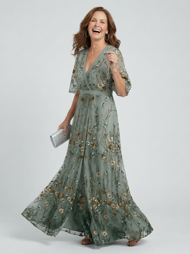FJØRNA elegant floral maxi dress for women with halter neck, flowing fabric, and stylish design for special occasions.