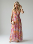 FJØRNA women's sleeveless summer maxi dress with wrap design, flowing fabric and vibrant pattern for warm-weather style.