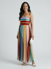 FJØRNA women's summer maxi dress with bold horizontal stripes, strapless design, flowing fabric, and vibrant colors.
