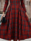 FJØRNA elegant long sleeve plaid dress with a classic and contemporary design, featuring a fitted waist and stylish pattern.