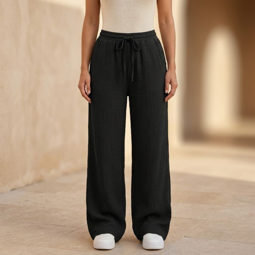 Women’s lightweight cotton wide-leg trousers by FJØRNA, casual pants with relaxed fit and flowy style.