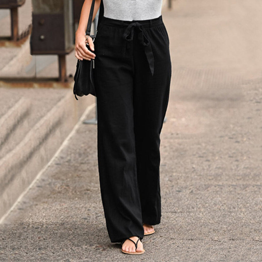 FJØRNA Jane women's wide-leg pants with high waist and drawstring, casual style, shown in a neutral fabric and relaxed fit.