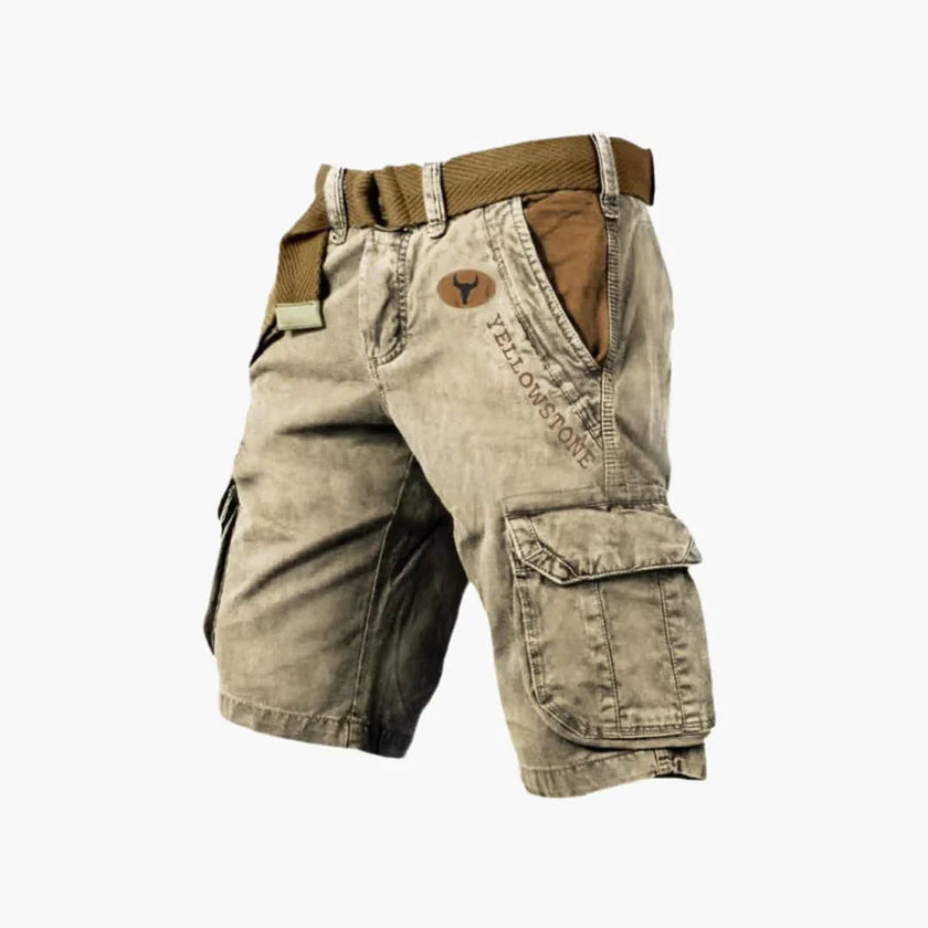Men's FJØRNA cargo shorts with multiple functional pockets and ample storage, shown in a casual outdoor setting.