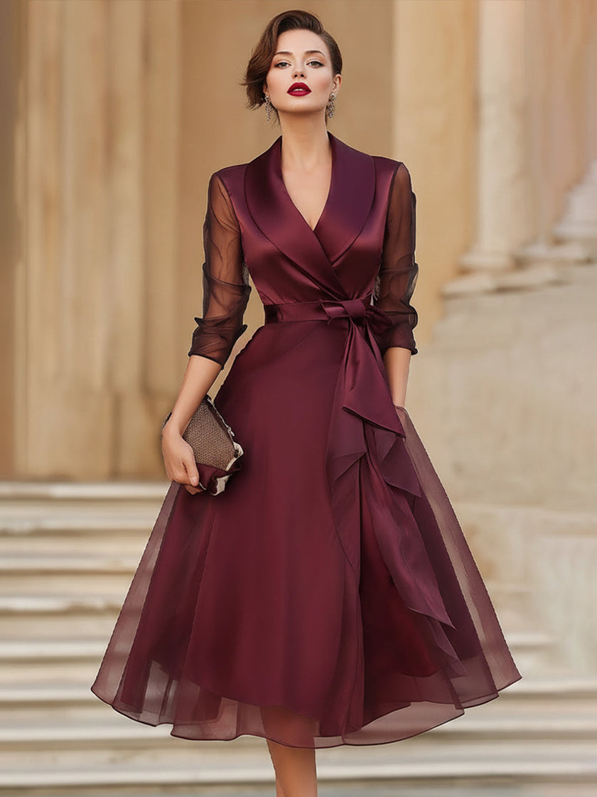 FJØRNA elegant wrap midi dress for women with sheer sleeves, featuring a sophisticated design and flowing silhouette.