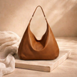 Large FJØRNA leather bag for women, stylish and spacious with sturdy handles and smooth leather finish.