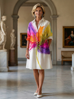 FJØRNA women's floral wrap summer dress with a feminine design and lightweight fabric, perfect for warm weather.