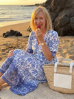 FJØRNA women's floral summer midi dress with flowy fabric and sleeveless design, perfect for warm weather and casual occasions.