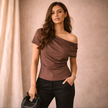 FJØRNA women's top, stylish and comfortable, shown in a close-up image highlighting the fabric and neckline design.