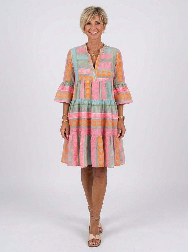 FJØRNA women's geometric tiered summer dress with sleeveless design and vibrant pattern, perfect for warm-weather wear.