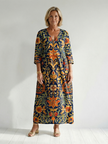 FJØRNA women's floral summer midi dress with long sleeves, wrap style, tailored fit, perfect for warm weather and casual occasions.