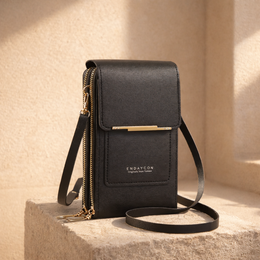 FJØRNA women's anti-theft travel crossbody bag with multiple compartments, black nylon material, and adjustable strap.