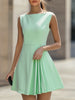 Mint FJØRNA pleated A-line mini dress with a fitted bodice and flared skirt, showcasing a stylish and elegant design.