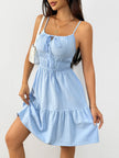 FJØRNA white sleeveless tiered sundress with drawstring detail, flowing fabric, and casual summer style in the image.