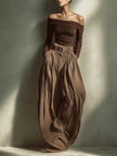 FJØRNA women's lightweight summer trousers with wide legs, high waist, and belt, made of comfortable, breathable fabric.