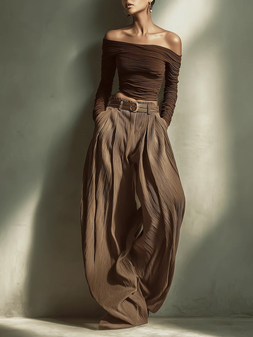 FJØRNA women's lightweight summer trousers with wide legs, high waist, and belt, made of comfortable, breathable fabric.