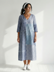 FJØRNA women's summer midi dress with long sleeves, wrap style, flowy and breathable fabric, perfect for warm weather.
