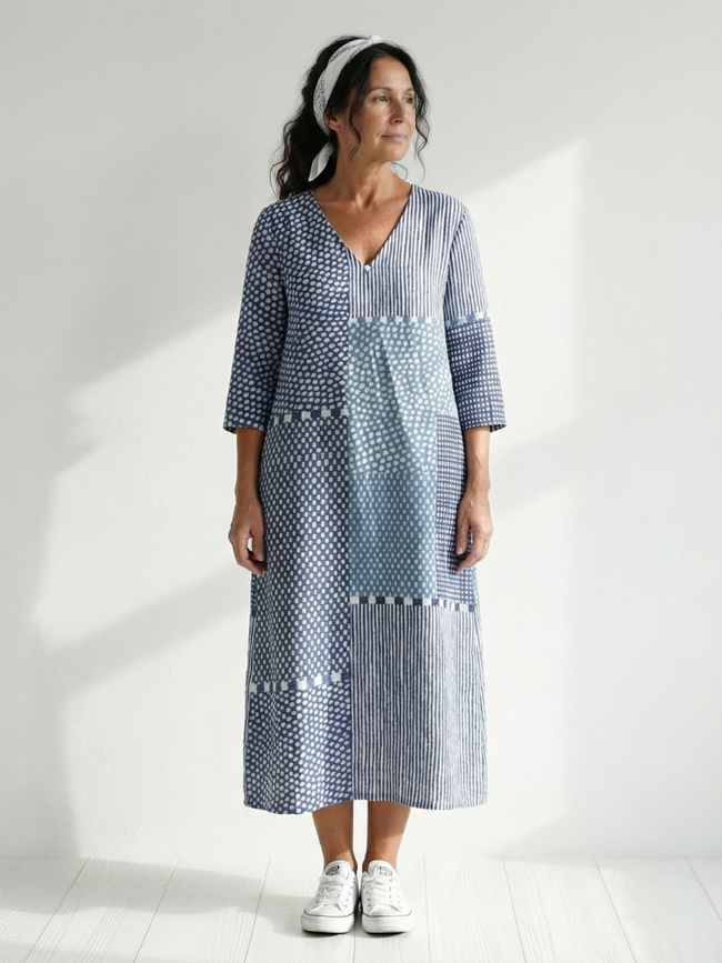 FJØRNA women's summer midi dress with long sleeves, wrap style, flowy and breathable fabric, perfect for warm weather.