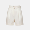FJØRNA women's high waist pleated shorts, stylish and comfortable pants with a flattering fit, shown in a natural pose.