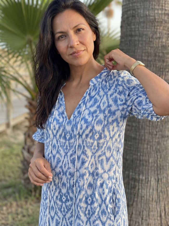 FJØRNA women's summer midi dress with geometric pattern, short sleeves, and wrap design, perfect for warm weather.