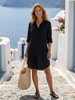 FJØRNA women's summer dress with long sleeves and slit, casual style, flowing fabric perfect for warm weather.