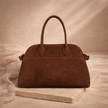 Vegan large suede handbag for women by FJØRNA, featuring a spacious design and elegant texture in neutral tones.