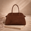 Vegan large suede handbag for women by FJØRNA, featuring a spacious design and elegant texture in neutral tones.