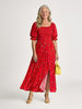FJØRNA women's floral summer midi dress with square neckline and puff sleeves, featuring a vibrant floral pattern and flowy silhouette.