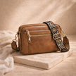 FJØRNA women's leather shoulder bag with adjustable strap and spacious interior, stylish and durable for everyday use.