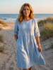 Flowy summer maxi dress for women by FJØRNA featuring pockets and casual, breezy design, perfect for warm weather.