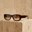 FJØRNA retro rectangular unisex sunglasses with dark lenses and thick frames, stylish accessories for women and men.