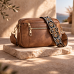 FJØRNA leather shoulder bag for women with adjustable strap and sleek design, ideal for everyday use and stylish accessorizing.