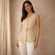 FJØRNA women's tweed top, stylish and textured, featuring a classic design with a fitted silhouette and neutral tones.