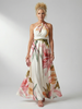 FJØRNA women's floral summer maxi dress with halter neck, sleeveless design, flowing fabric, ideal for warm weather.