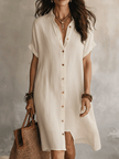FJØRNA black linen midi dress with a relaxed fit, featuring a modern boho style, sleeveless design, and flowing silhouette.