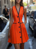 Vibrant orange FJØRNA button-front A-line dress with a fitted waist and knee-length hem, perfect for casual or semi-formal wear.