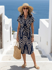 FJØRNA women's summer midi dress with geometric pattern, short sleeves, and a relaxed fit, perfect for warm weather.