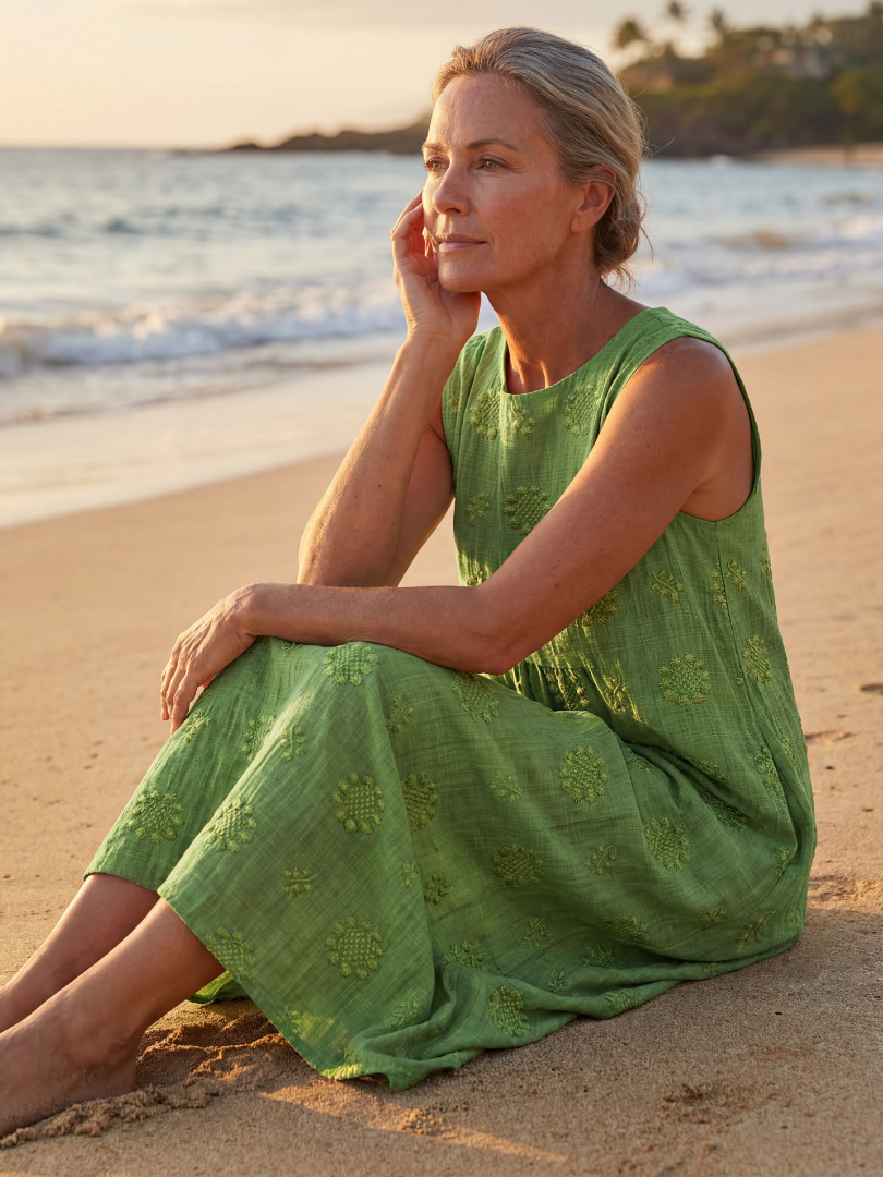 FJØRNA women's summer midi dress, sleeveless and flowy, made of lightweight, breathable fabric for warm weather.