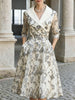FJØRNA silver embroidered mesh midi dress with metallic leaf motifs, showcasing intricate embroidery and elegant design.