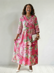 FJØRNA women's floral summer midi dress with long sleeves, flowy fabric, perfect for warm-weather occasions.