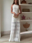 FJØRNA delicate hollow pleated lace-up women's maxi evening dress with flowing fabric and intricate lace details.