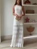 FJØRNA delicate hollow pleated lace-up women's maxi evening dress with flowing fabric and intricate lace details.